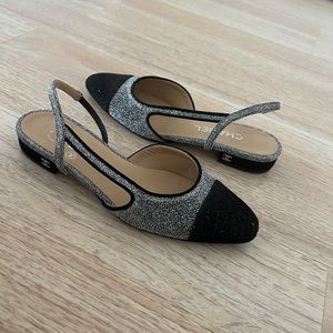 Chanel slingblack flats. Silver and black cap toe. Excellent condition.